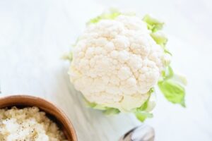 Cauliflower and a bowl of cauliflower rice 
